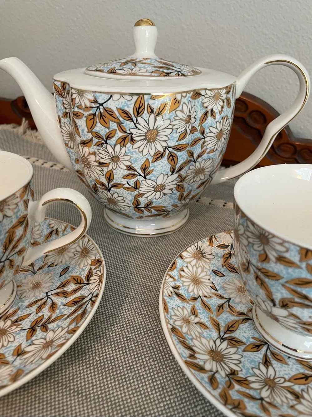 Elegant Floral Porcelain Teapot and Cup Set in Blue and Gold